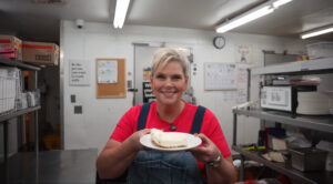 Michelle at Local Flavor with a piece of vanilla bean cheese cake