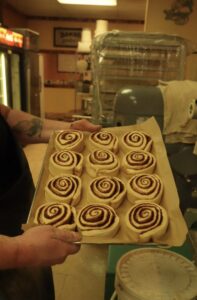 Cinnamon rolls ready to go in the oven at Old Fashioned Dough Company