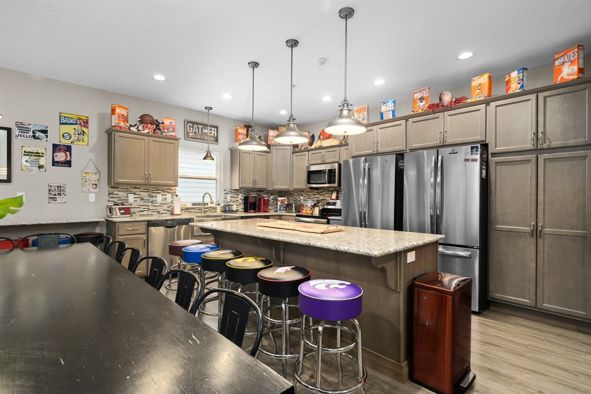 Sports-themed great room at Game Day Lodge, a ten-bedroom Chateau Cove lake house in Branson that sleeps 28