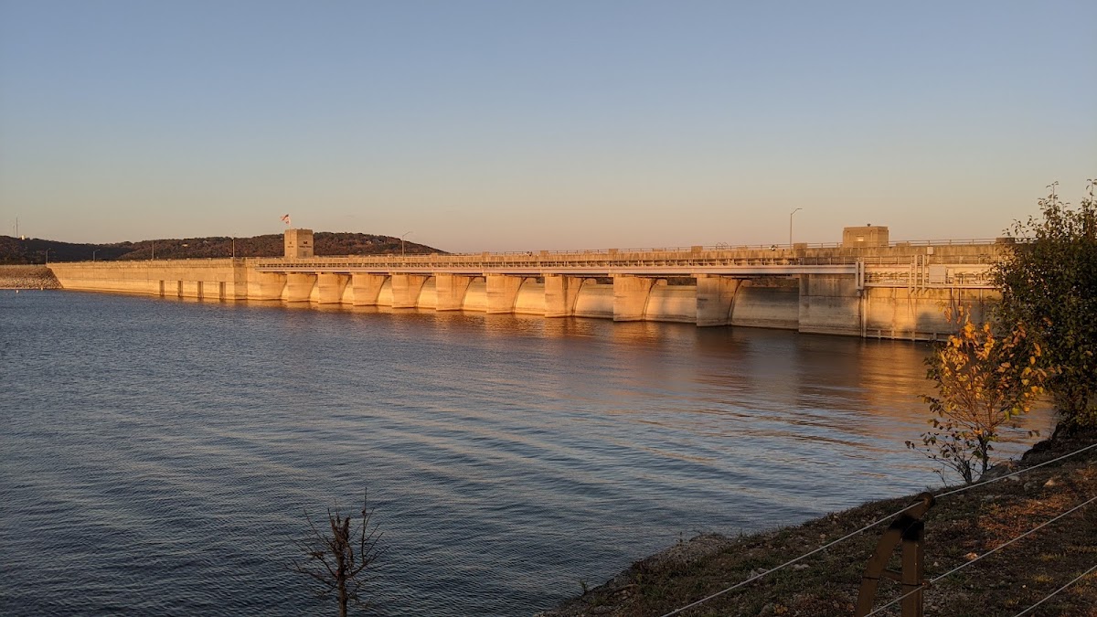 Table Rock Dam stretching across the water at golden hour along Highway 165, one of the most scenic drives around Branson