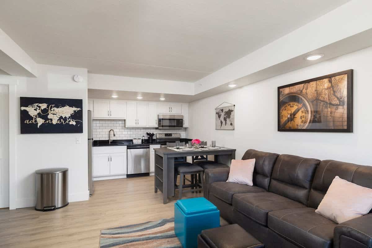 Open-plan living and dining area with a high-top table inside Peaceful Condo Near Convention Center in Branson, Missouri