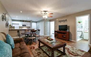 Enclosed patio with golf course views at Shelter in Faith, a two-bedroom Thousand Hills condo in Branson that sleeps 8
