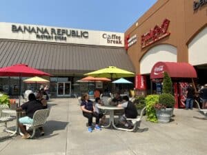 Shoppers at Tanger Outlets Branson Missouri — 75+ brand-name stores including Nike, Coach, and Lululemon