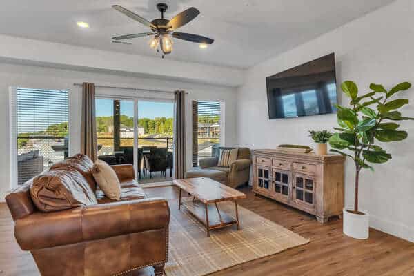 Open living room with balcony lake views at a Branson holiday vacation home near the Christmas lights
