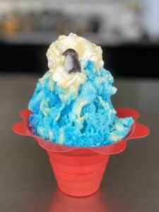 Stuffed snow cone shaved ice with ice cream at Swick's Shaved Ice Branson Missouri the most popular menu item