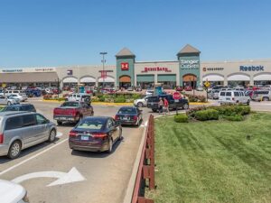 Shoppers exploring the open-air storefronts at Tanger Outlets Branson, Missouri, home to 75+ designer and brand-name outlet stores.