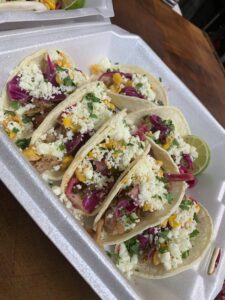 Hand-chopped brisket street tacos with elote at Come and Take It BBQ near Silver Dollar City