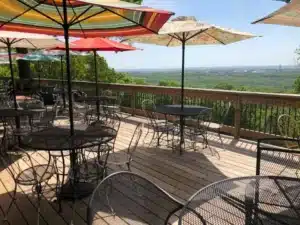 Hilltop deck view over the Ozark hills at Lindwedel Winery during a wine tasting Branson visitors love