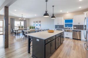 Professionally designed kitchen in a premium Branson vacation rental — granite counters, stainless appliances, oversized island
