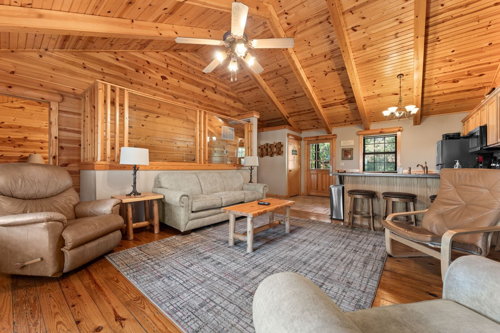 Wooded cabin exterior and deck at Ozarks Oasis in Branson Woods, Branson, Missouri