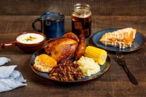 Four-course dinner served during Dolly Parton’s Stampede Branson including rotisserie chicken and pulled pork