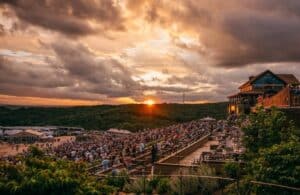 Thunder Ridge Nature Arena Branson 2026 concert crowd with Ozark Mountains and Table Rock Lake as backdrop
