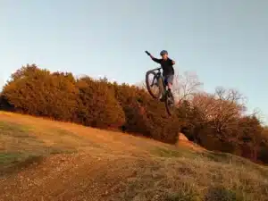 Downhill gravity riding at Howler Bike Park near Branson Missouri — shuttle-served jump lines and berms