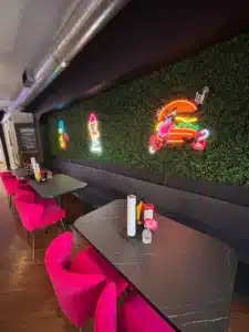 The beach-themed interior of Sweet Shack in Hollister, Missouri — casual seating and board games