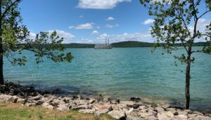 . Couple hiking Table Rock Lakeshore Trail Branson Missouri scenic Ozarks nature walk romantic outdoor activity