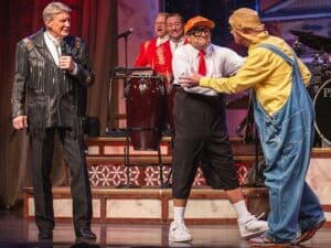 Comedians performing improv with audience participation, the style of Branson's Comedy Jamboree