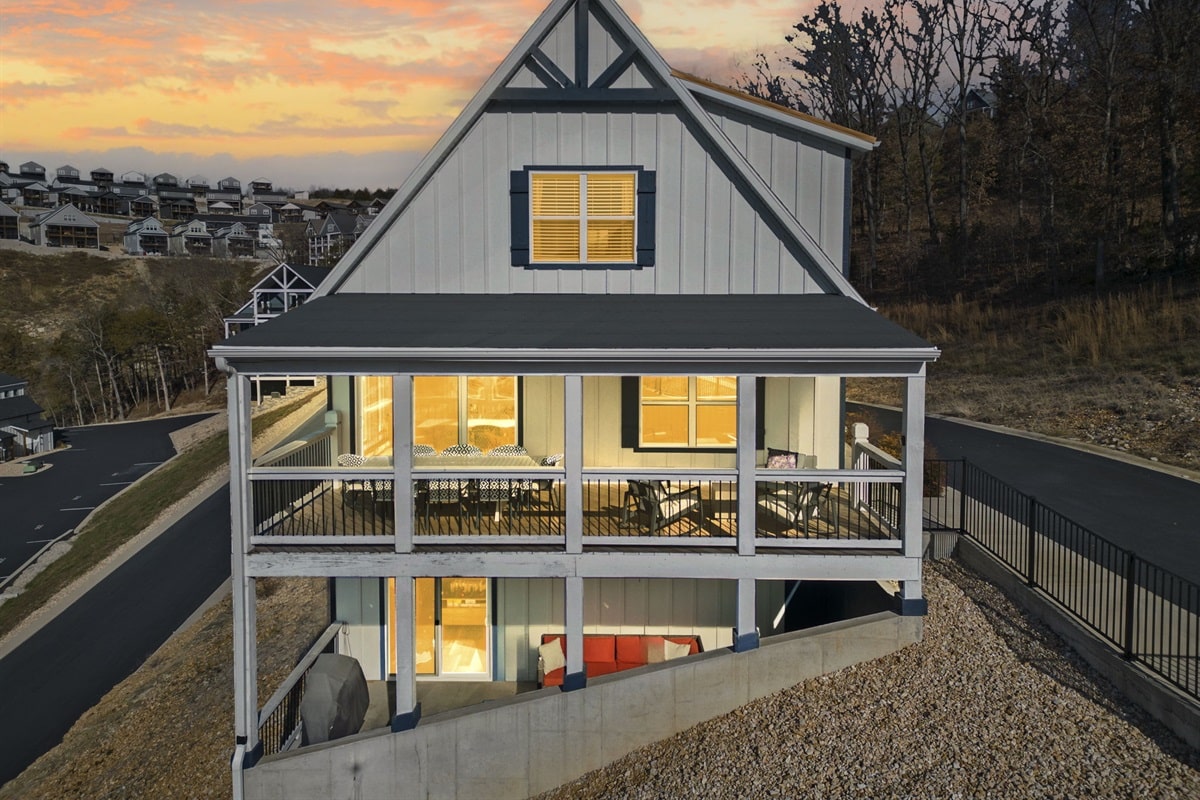 Lounging Lakeside vacation rental Chateau Cove Branson Missouri sleeps 18 with Table Rock Lake views