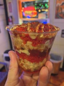 Street Heat corn in a cup at Lala's Street Food in Branson West — elote-style corn loaded with toppings