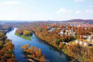 Ozark Fall Colors: hills covered in orange and gold fall foliage above Table Rock Lake near Branson, Missouri