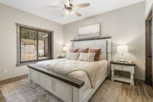 King bedroom with ensuite bathroom in an upscale Branson vacation home — the layout standard for premium rentals