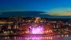Branson Landing fountain show at dusk over Lake Taneycomo