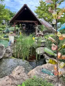 The Garden Center by Zanescapes in Branson West Missouri — greenhouses and plantings surrounding the bistro