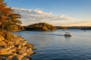Calm Table Rock Lake near Branson Missouri in early September with warm light and few boats