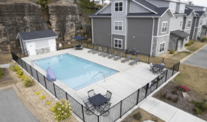 Outdoor pool and patio at the Family-Friendly Condo near SDC, a four-bedroom Branson condo with Ozark views