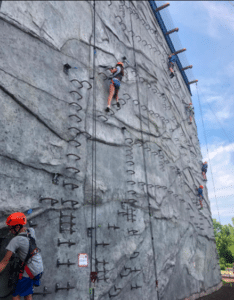 Climber on the outdoor via ferrata wall at Fritz’s Adventure, Branson rock climbing