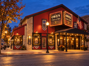 Historic Owen Theatre front lit at night on Commercial Street in downtown Branson