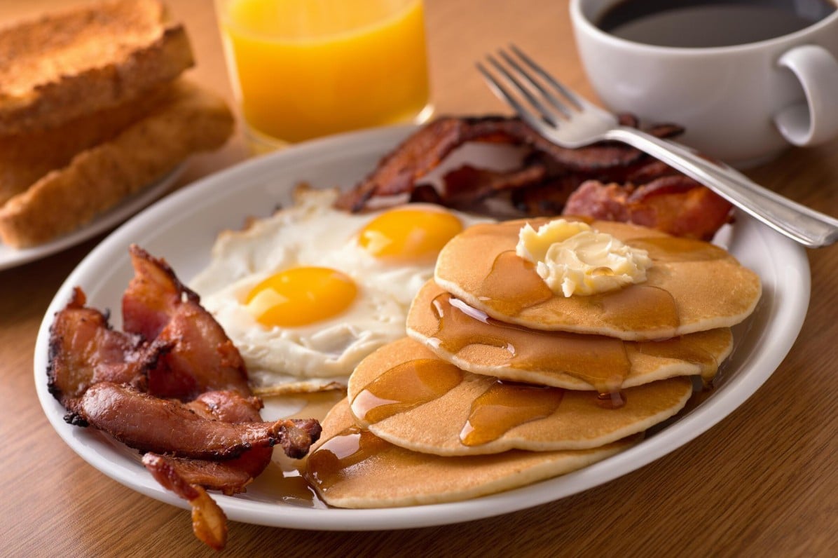 Branson breakfast spread of pancakes, eggs, and coffee at a local cafe