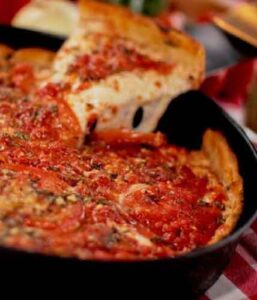 Chicago pan pizza in a cast iron pan at Mr. Gilberti's Place in Hollister, Missouri
